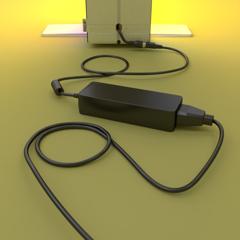 untere Ecke einer PIXLIP GO Lightbox mit Kabel und Netzgerät verbunden auf gelbem Boden